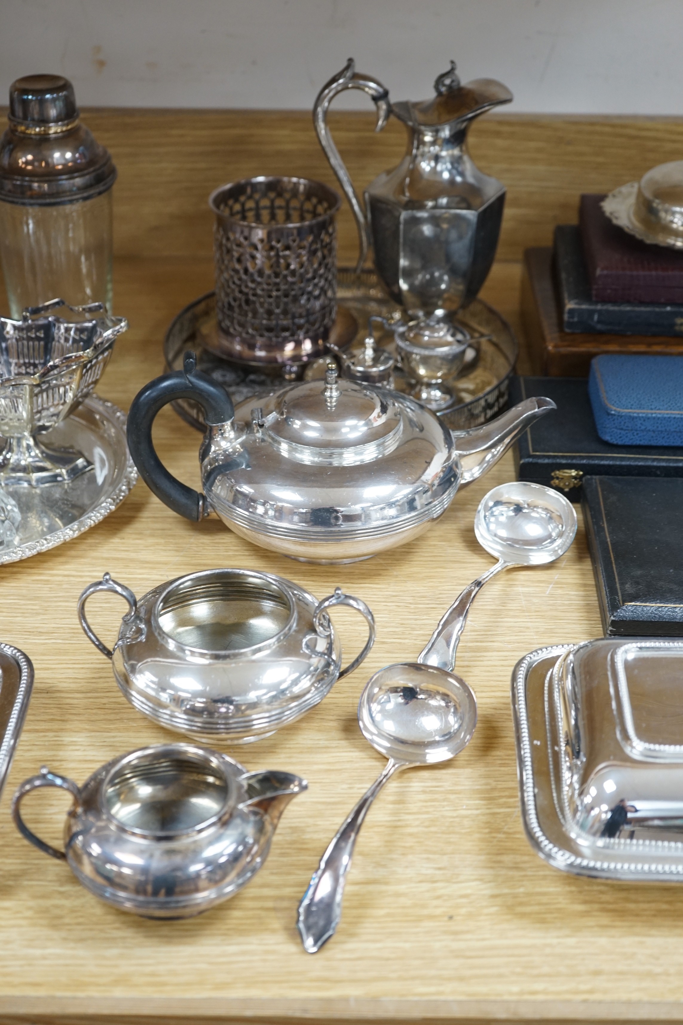 A quantity of silver plate including a cocktail shaker and a ewer